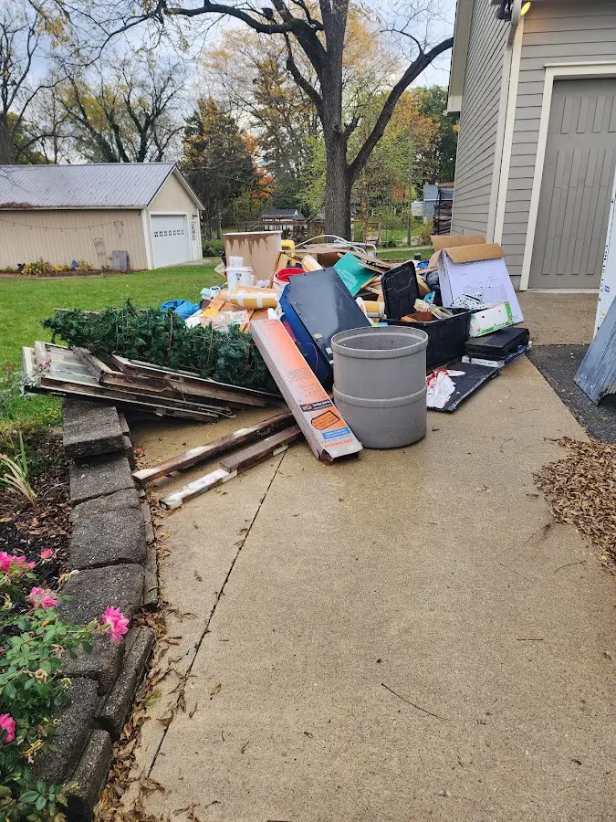 Dumpster being loaded with debris for Estate Cleanout Dumpster Rental in Rancho Mission Viejo